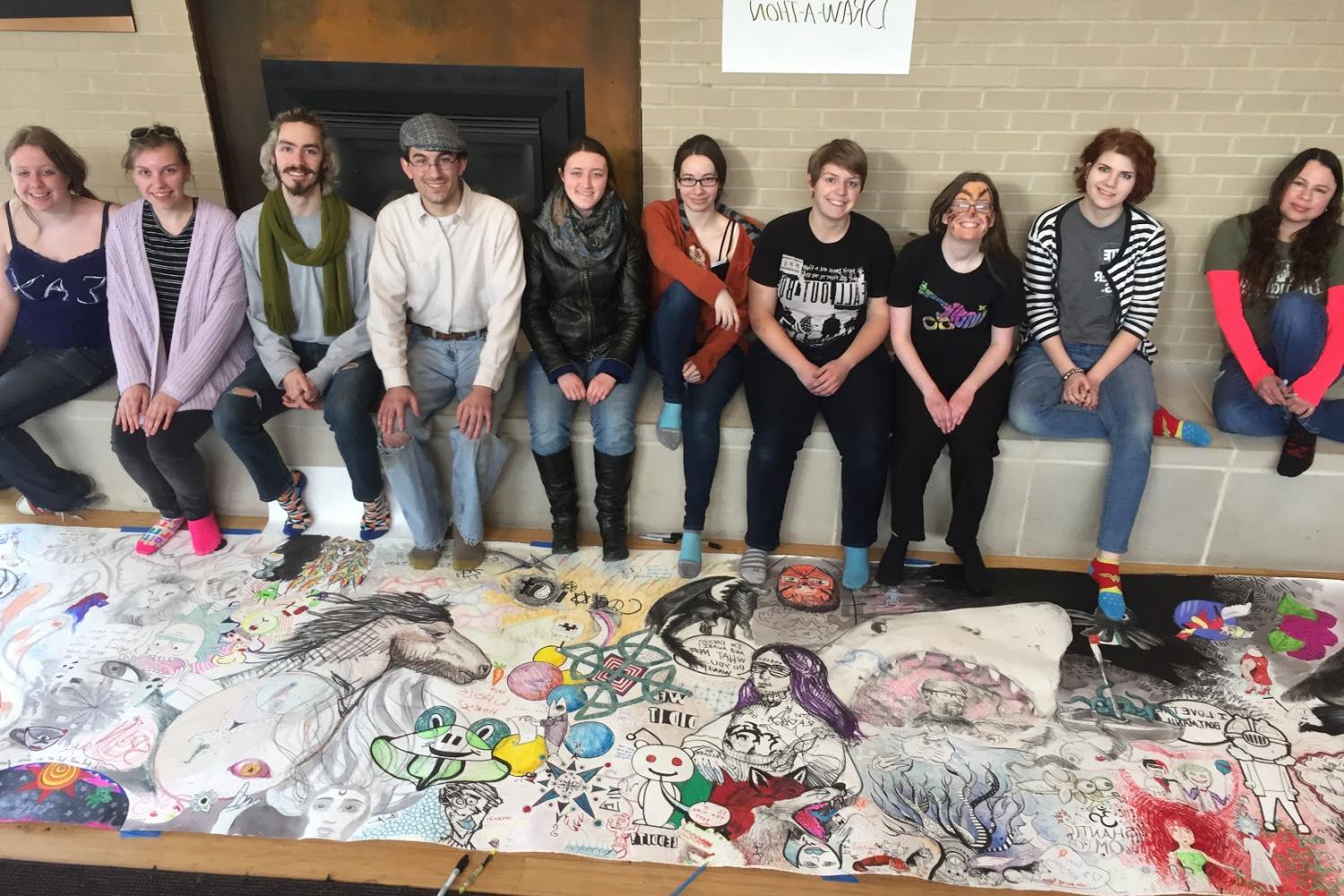 Students show off their work during a 24-hour Draw-A-Thon. (Fall 2017)
